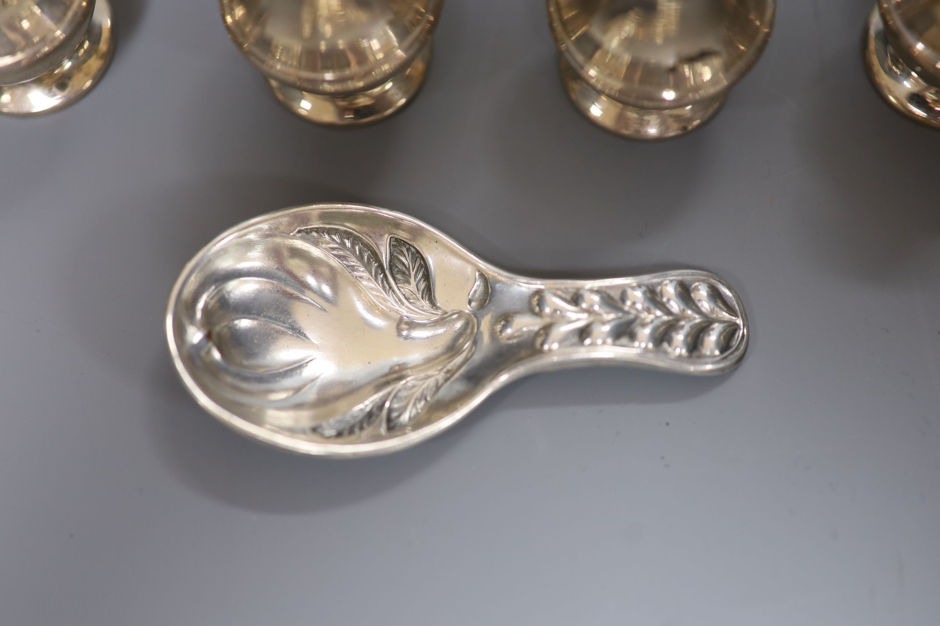 A set of eight modern silver condiments, 48mm, 89 grams and a silver plated caddy spoon.